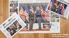 Newspapers showing Trump and Kim Jong Un